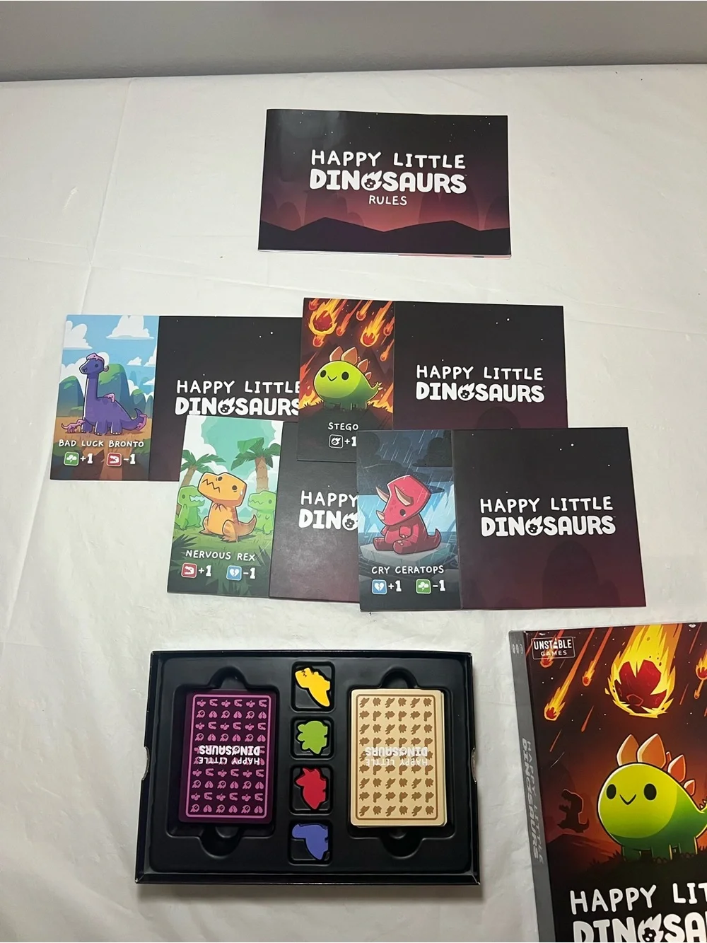 Unstable Games Happy Little Dinosaurs -Smile, It's Almost Over Board Game
